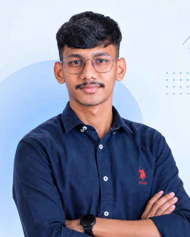 Vidyadaran M with arms crossed